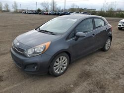 Salvage cars for sale from Copart Montreal Est, QC: 2013 KIA Rio EX