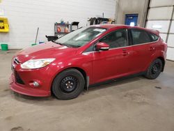 Salvage cars for sale from Copart Blaine, MN: 2012 Ford Focus SEL