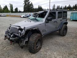 Salvage cars for sale from Copart Graham, WA: 2015 Jeep Wrangler Unlimited Sport
