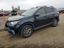 Salvage cars for sale at San Diego, CA auction: 2018 Toyota Rav4 HV LE