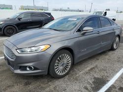 Salvage cars for sale at Van Nuys, CA auction: 2014 Ford Fusion Titanium HEV