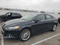 Salvage cars for sale at Van Nuys, CA auction: 2014 Ford Fusion SE Hybrid