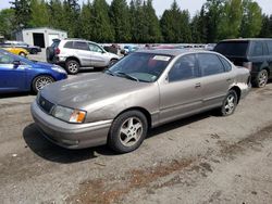 Salvage cars for sale from Copart Arlington, WA: 1999 Toyota Avalon XL