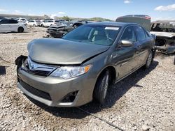 Salvage cars for sale at Magna, UT auction: 2014 Toyota Camry Hybrid