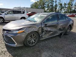 Salvage cars for sale at Arlington, WA auction: 2023 Toyota Camry XLE