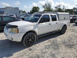 Salvage trucks for sale at Opa Locka, FL auction: 2003 Nissan Frontier Crew Cab XE