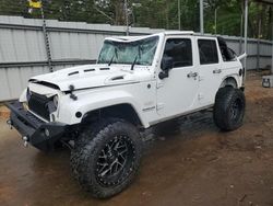 Salvage cars for sale at Austell, GA auction: 2014 Jeep Wrangler Unlimited Sahara