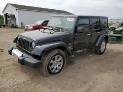 Salvage cars for sale at Portland, MI auction: 2014 Jeep Wrangler Unlimited Sahara