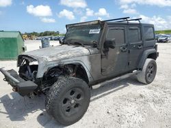 Salvage cars for sale from Copart West Palm Beach, FL: 2011 Jeep Wrangler Unlimited Sport