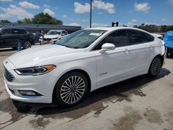 Vehiculos salvage en venta de Copart Orlando, FL: 2017 Ford Fusion Titanium HEV