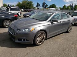Salvage cars for sale at Woodburn, OR auction: 2014 Ford Fusion Titanium