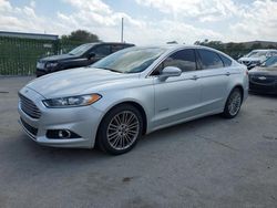Vehiculos salvage en venta de Copart Orlando, FL: 2014 Ford Fusion SE Hybrid