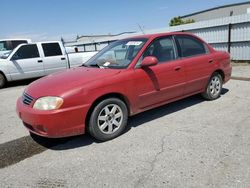Salvage cars for sale from Copart Bakersfield, CA: 2002 KIA Spectra Base