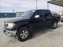 Salvage cars for sale from Copart Anthony, TX: 2009 Nissan Frontier Crew Cab SE