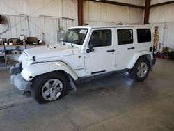 Salvage cars for sale from Copart Billings, MT: 2012 Jeep Wrangler Unlimited Sahara