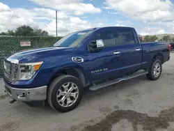 Salvage cars for sale from Copart Orlando, FL: 2017 Nissan Titan XD SL