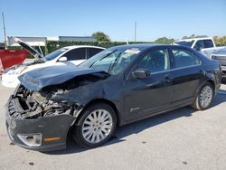 Salvage cars for sale from Copart Orlando, FL: 2010 Ford Fusion Hybrid