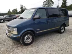 Salvage trucks for sale at Graham, WA auction: 2000 Chevrolet Astro