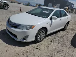 Salvage cars for sale at Magna, UT auction: 2014 Toyota Camry Hybrid