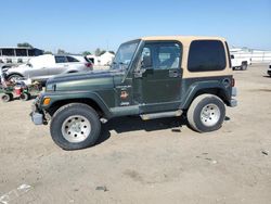 Salvage cars for sale from Copart Bakersfield, CA: 1998 Jeep Wrangler / TJ Sahara