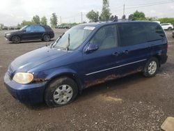 Salvage cars for sale from Copart Montreal Est, QC: 2004 KIA Sedona EX