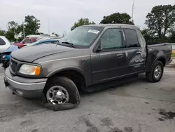 Salvage trucks for sale at Sikeston, MO auction: 2002 Ford F150 Supercrew