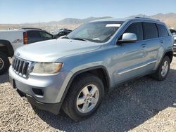 Salvage SUVs for sale at auction: 2012 Jeep Grand Cherokee Laredo