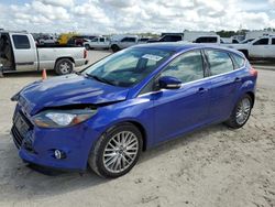 Salvage cars for sale at Houston, TX auction: 2013 Ford Focus Titanium