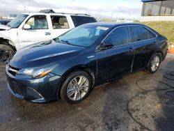 Flood-damaged cars for sale at auction: 2015 Toyota Camry Hybrid