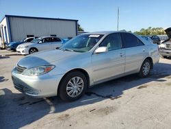 Salvage cars for sale from Copart Orlando, FL: 2004 Toyota Camry LE