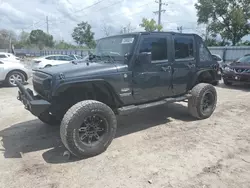 Salvage cars for sale at Riverview, FL auction: 2010 Jeep Wrangler Unlimited Sahara