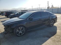 Salvage cars for sale at auction: 2018 Toyota Camry Hybrid