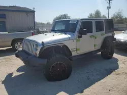 Salvage cars for sale from Copart Midway, FL: 2011 Jeep Wrangler Unlimited Sport