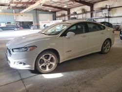 Salvage cars for sale at Eldridge, IA auction: 2013 Ford Fusion SE Hybrid