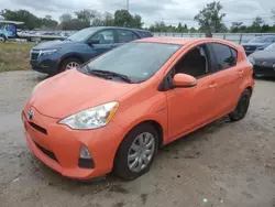 Flood-damaged cars for sale at auction: 2014 Toyota Prius C