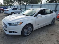 Flood-damaged cars for sale at auction: 2014 Ford Fusion Titanium HEV