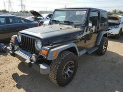 Salvage cars for sale from Copart Elgin, IL: 2002 Jeep Wrangler / TJ Sport