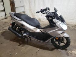 Salvage motorcycles for sale at Ebensburg, PA auction: 2016 Honda PCX 150
