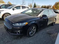 Salvage cars for sale at Lansing, MI auction: 2015 Ford Fusion Titanium HEV