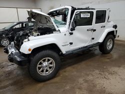 Salvage cars for sale at Davison, MI auction: 2014 Jeep Wrangler Unlimited Sahara