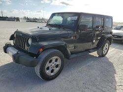 Salvage cars for sale from Copart Arcadia, FL: 2014 Jeep Wrangler Unlimited Sahara