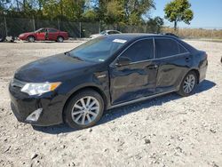 Salvage vehicles for parts for sale at auction: 2012 Toyota Camry Hybrid