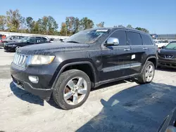 Flood-damaged cars for sale at auction: 2011 Jeep Grand Cherokee Overland