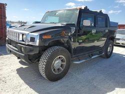 Salvage cars for sale from Copart Arcadia, FL: 2005 Hummer H2 SUT