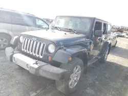 Salvage vehicles for parts for sale at auction: 2013 Jeep Wrangler Unlimited Sahara