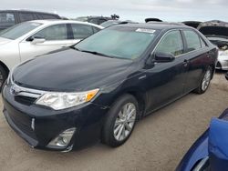 Flood-damaged cars for sale at auction: 2012 Toyota Camry Hybrid