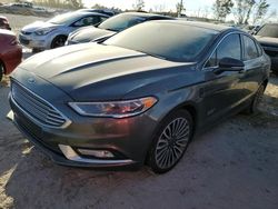 Flood-damaged cars for sale at auction: 2017 Ford Fusion Titanium Phev