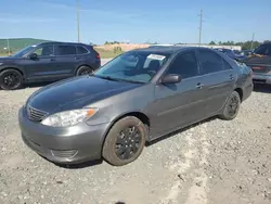 Flood-damaged cars for sale at auction: 2005 Toyota Camry LE