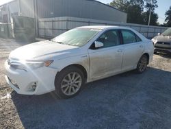 Flood-damaged cars for sale at auction: 2013 Toyota Camry Hybrid