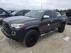 Flood-damaged cars for sale at auction: 2018 Toyota Tacoma Access Cab